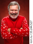The expressive portrait on red background of a pouter man. Стоковое фото, фотограф Volodymyr Melnyk / PantherMedia / Фотобанк Лори