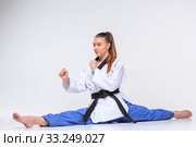 The karate girl with black belt. Стоковое фото, фотограф Volodymyr Melnyk / PantherMedia / Фотобанк Лори