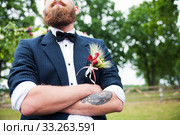Groom in white shirt and bow tie his arms folded. Стоковое фото, фотограф Sergiy Artsaba / PantherMedia / Фотобанк Лори