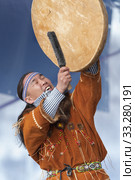 Aboriginal dancer in traditional clothes of native people dancing with tambourine. Concert Koryak Dance Ensemble Mengo (2019 год). Редакционное фото, фотограф А. А. Пирагис / Фотобанк Лори