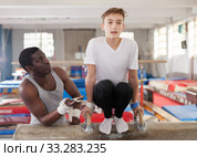 Ordinary African male coach helping teenage boy. Стоковое фото, фотограф Яков Филимонов / Фотобанк Лори