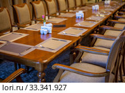 Restaurant interior table set for meal. Стоковое фото, фотограф Evgenii Mitroshin / Фотобанк Лори