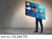 Businessman in credit card burden concept in pillory. Стоковое фото, фотограф Elnur / Фотобанк Лори