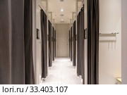 Lighted corridor with curtained doors on sides. Стоковое фото, фотограф Ekaterina Demidova / Фотобанк Лори