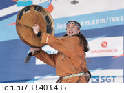 Male dancer in national clothes indigenous people emotional dancing with tambourine. Concert Koryak Dance Ensemble Mengo (2019 год). Редакционное фото, фотограф А. А. Пирагис / Фотобанк Лори