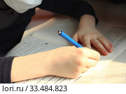 Close-up children hands with blue pen. Concept of home schooling in quarantine. Стоковое фото, фотограф Попова Ольга / Фотобанк Лори