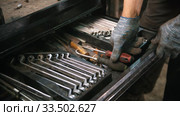A set of different wrenches in different sizes in the box case - man choosing the one for him. Стоковое видео, видеограф Константин Шишкин / Фотобанк Лори