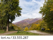 Majestic autumn panoramic view in the mountains landscape, car on the road. Стоковое фото, фотограф Ирина Мойсеева / Фотобанк Лори