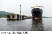 Huge black ferry ship is moored in port. Varna (2014 год). Стоковое фото, фотограф EugeneSergeev / Фотобанк Лори