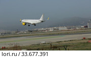 Large passenger airliner of Vueling Airlines with EC-NCS registration number landing in International El Prat Airport in Barcelona (2020 год). Редакционное видео, видеограф Яков Филимонов / Фотобанк Лори