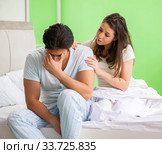 Young woman consoling disappointed impotent husband. Стоковое фото, фотограф Elnur / Фотобанк Лори