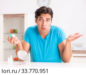 Man trying contact lenses at home. Стоковое фото, фотограф Elnur / Фотобанк Лори