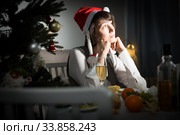 Bored woman watching Christmas tv program. Стоковое фото, фотограф Яков Филимонов / Фотобанк Лори
