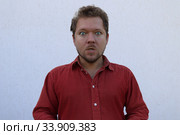 Портрет мужчины с бородой с разными эмоциями на лице. Стоковое фото, фотограф Кузнецов Максим / Фотобанк Лори