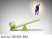Debt and loan concept with businessman and seesaw. Стоковое фото, фотограф Elnur / Фотобанк Лори