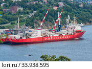 Russian cargo container ship nuclear-powered icebreaker Sevmorput Corporation FSUE Atomflot or Rosatomflot. Container terminal commercial seaport. Pacific Ocean (2019 год). Редакционное фото, фотограф А. А. Пирагис / Фотобанк Лори