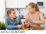 Woman taking away phone from teenage. Стоковое фото, фотограф Яков Филимонов / Фотобанк Лори
