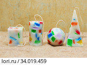 Handmade candles in the shape of a pyramid, cube, cylinder and sphere. Стоковое фото, фотограф Nataliia Zhekova / Фотобанк Лори