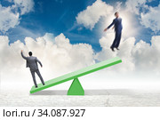 Competition concept with businessman and seesaw. Стоковое фото, фотограф Elnur / Фотобанк Лори