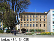 City of Lugano at the lake Lugano on a spring sunny day. View of the old bank buidling on the Alessandro Manzoni Square. Canton of Ticino, Switzerland, Europe. (2018 год). Редакционное фото, фотограф Bala-Kate / Фотобанк Лори
