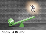 Debt and loan concept with businessman and seesaw. Стоковое фото, фотограф Elnur / Фотобанк Лори