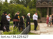 Russia, Veliky Novgorod, Yuriev monastery-July 14, 2020: Archimandrite Eli (Nozdrin), Metropolitan Lev of Novgorod and old Russia, Bishop Arseny of Yuriev, together with the brethren of the monastery, leave St. George's Cathedral after the prayer service. Редакционное фото, фотограф Филатова Ирина / Фотобанк Лори