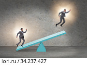 Competition concept with businessman and seesaw. Стоковое фото, фотограф Elnur / Фотобанк Лори