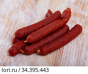 Appetizing tyrolean sausages on wooden table. Стоковое фото, фотограф Яков Филимонов / Фотобанк Лори