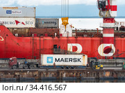 Crane unloading container cargo ship Sevmorput Rosatomflot - Russian nuclear-powered icebreaker lighter aboard ship carrier (2019 год). Редакционное фото, фотограф А. А. Пирагис / Фотобанк Лори