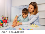 ABA therapy class woman teach autistic boy weather. Стоковое фото, фотограф Сергей Новиков / Фотобанк Лори