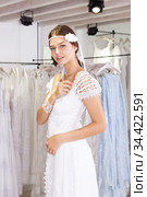 Woman flaunting dressed in wedding gown. Стоковое фото, фотограф Яков Филимонов / Фотобанк Лори