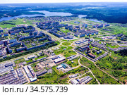Aerial view on the movement of cars on the ring road. Top view of the city and car junctions. Стоковое фото, фотограф Евгений Ткачёв / Фотобанк Лори
