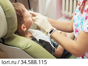 A little boy at a dentist's reception in a dental clinic. Children's dentistry, Pediatric Dentistry. Стоковое фото, фотограф Nataliia Zhekova / Фотобанк Лори