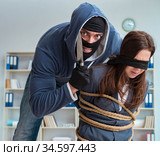 Criminal taking businesswoman as hostage in office. Стоковое фото, фотограф Elnur / Фотобанк Лори