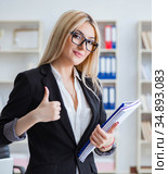 Young office assistant in the office. Стоковое фото, фотограф Elnur / Фотобанк Лори