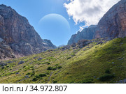 Fictional landscape of some earth-like exoplanet with a huge satellite in the sky. Стоковое фото, фотограф Евгений Харитонов / Фотобанк Лори