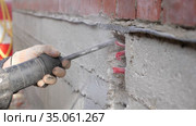 Construction work. Puncher making holes in concrete. Стоковое видео, видеограф Константин Мерцалов / Фотобанк Лори