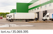 Russia Samara March 2020: A large van stands unloading outside a warehouse on a summer day. Редакционное фото, фотограф Акиньшин Владимир / Фотобанк Лори