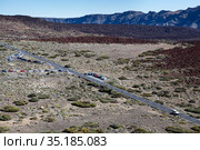 Asphalt highway in mountain valley, aerial view. TF-21 route with turn to Teide Cable car. Tenerife, Canary, Spain (2016 год). Стоковое фото, фотограф Кекяляйнен Андрей / Фотобанк Лори
