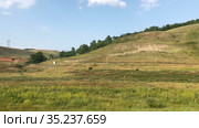 Hills and valleys with grasslands are in Bashkortostan republic, panoramic review at summer season. Russia. Стоковое видео, видеограф Кекяляйнен Андрей / Фотобанк Лори