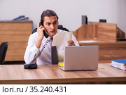 Young male employee unhappy with office prank in the office. Стоковое фото, фотограф Elnur / Фотобанк Лори