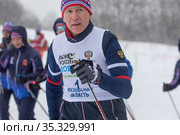 Министр спорт РФ Матыцин Олег Васильевич принимает участие в XXXIX открытой Всероссийской массовой лыжной гонке "Лыжня России" на территории олимпийского учебно-спортивного центра "Планерная" в городе Химки, Московской области, Россия (2021 год). Редакционное фото, фотограф Николай Винокуров / Фотобанк Лори