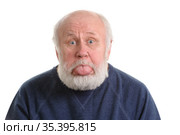 senior man with sticking tongue out, isolated portrait. Стоковое фото, фотограф Сергей Старуш / Фотобанк Лори