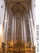 The interior of St. Jacob's Church with  altar of the Twelve Apostles in Rothenburg ob der Tauber, Bavaria, Germany (2012 год). Редакционное фото, фотограф Наталья Волкова / Фотобанк Лори