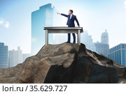 Businessman self isolating on the top. Стоковое фото, фотограф Elnur / Фотобанк Лори