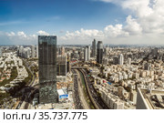 Top view of Tel Aviv, Ayalon Highway and Ramat Gan district from the observation deck of the round tower of the Azrieli center. Israel (2017 год). Редакционное фото, фотограф Наталья Волкова / Фотобанк Лори