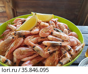Shrimps with beer on a wooden table. Стоковое фото, фотограф Марина Володько / Фотобанк Лори