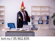 Funny young male employee magician and too much work in the office. Стоковое фото, фотограф Elnur / Фотобанк Лори