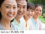 Multi generational family portrait, outdoors Beijing. Стоковое фото, агентство Ingram Publishing / Фотобанк Лори