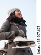 Young woman ice skating portrait, Beijing. Стоковое фото, агентство Ingram Publishing / Фотобанк Лори
